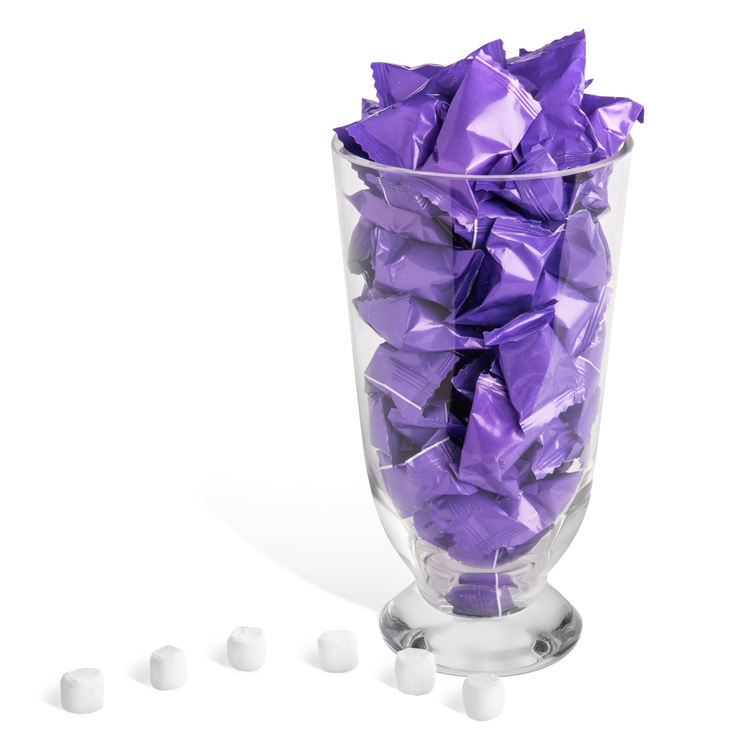 Candy Envy wedding table setup showing violet-wrapped mints for favors.
