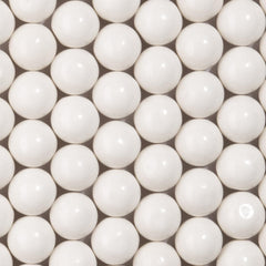Close up view of Candy Envy white gumballs glossy texture