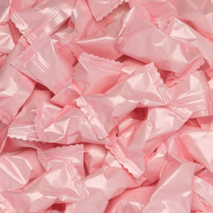 Candy Envy white mints closeup wrappers appealing for weddings and dessert tables.