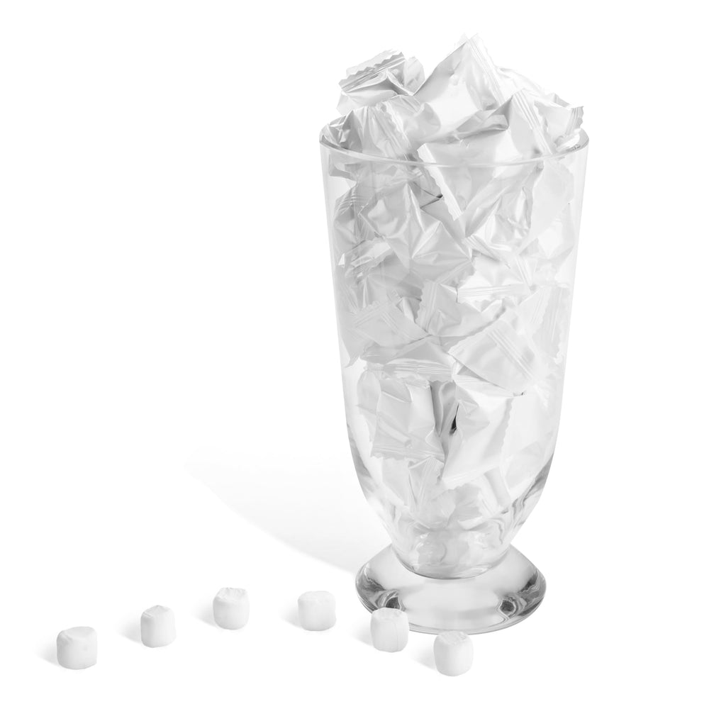 Candy Envy white-wrapped buttermints arranged in a decorative candy dish.