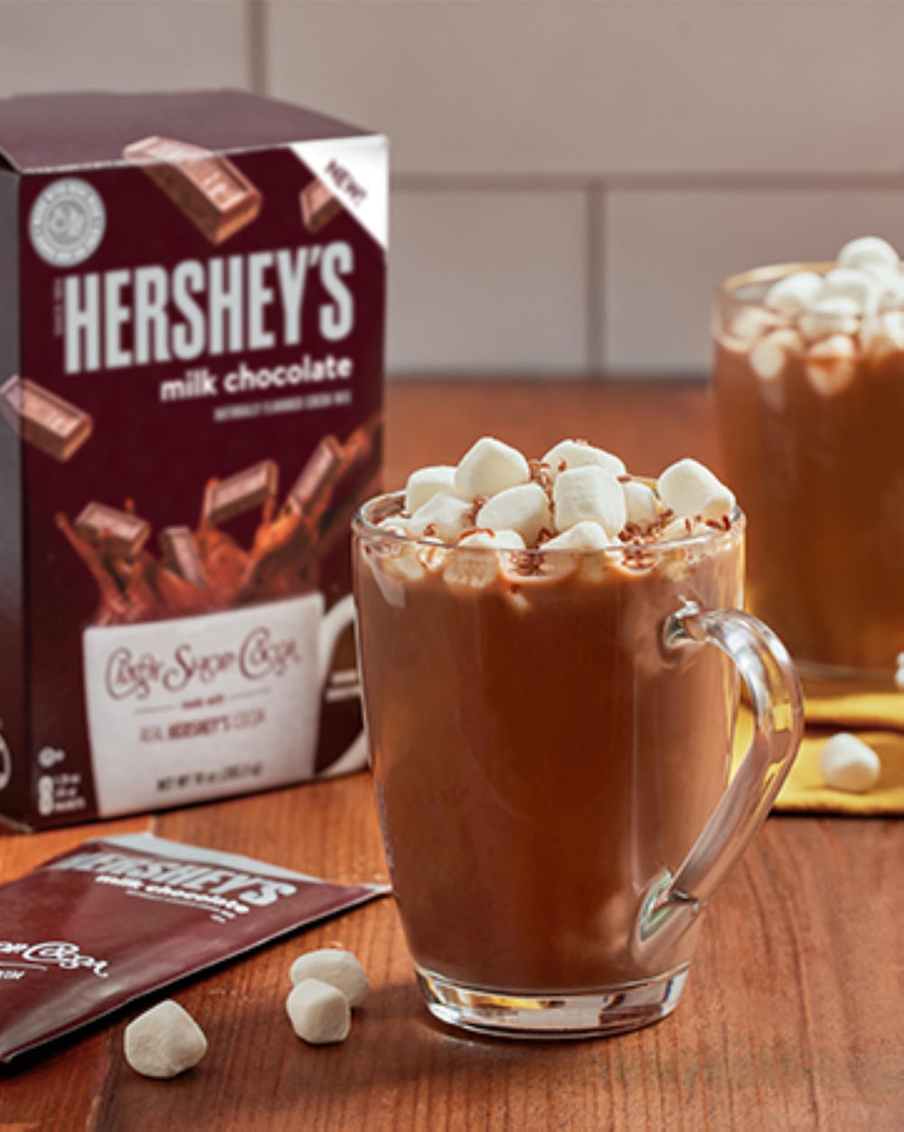 Candy Shop Cocoa stir action shows powder dissolving into creamy mug.