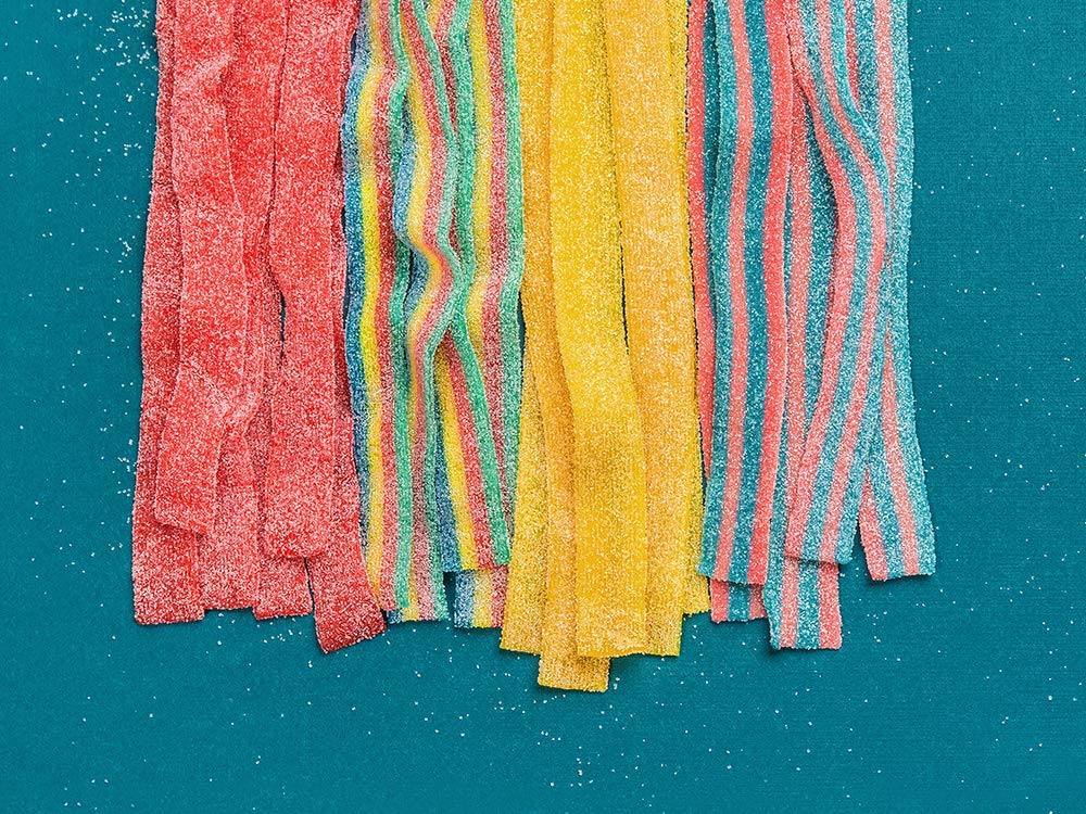 Candy Club rainbow sour belts party-favor display offering bright colors and fun taste