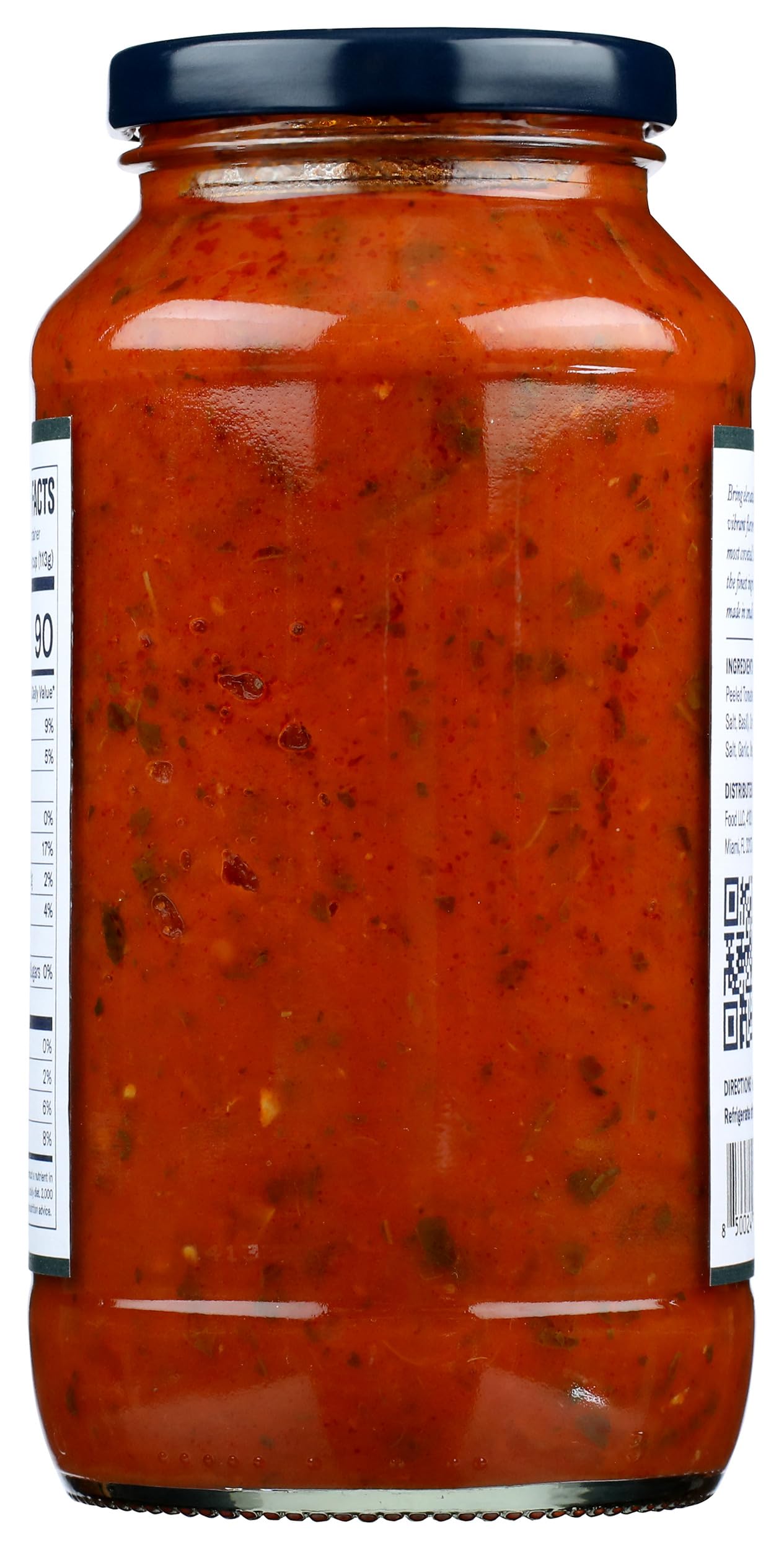 Carbone tomato basil pasta sauce pouring over cooked pasta