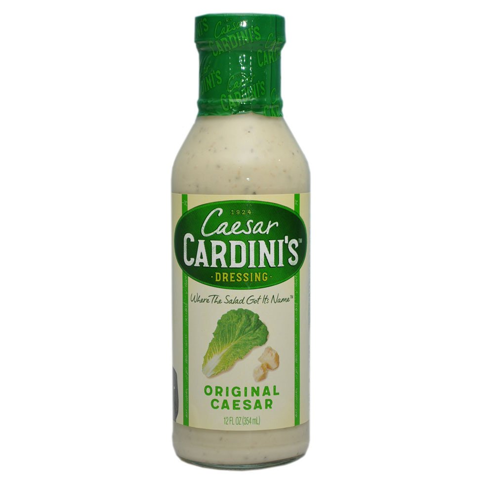 Cardini's Caesar dressing bottle highlighting creamy texture for salads.