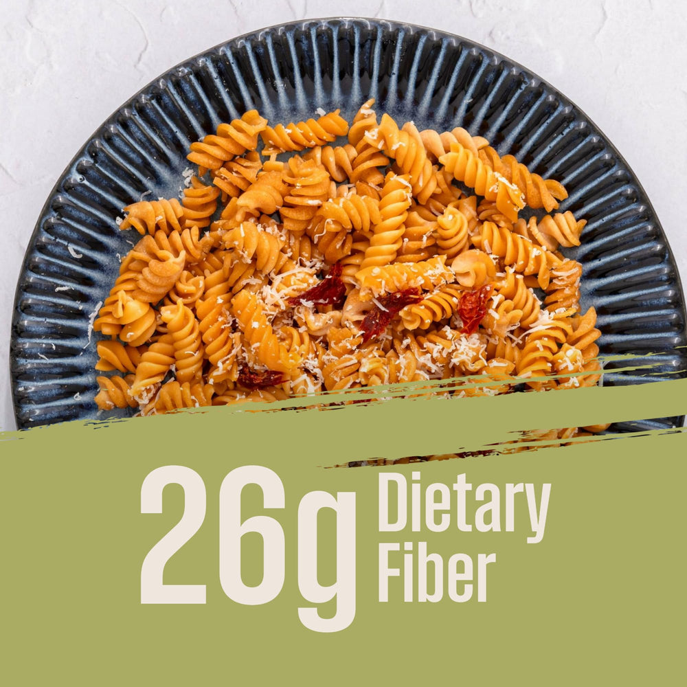 Creamy sauce poured over Care Free Kitchen Sundried Tomato Rotini, keto-friendly idea.