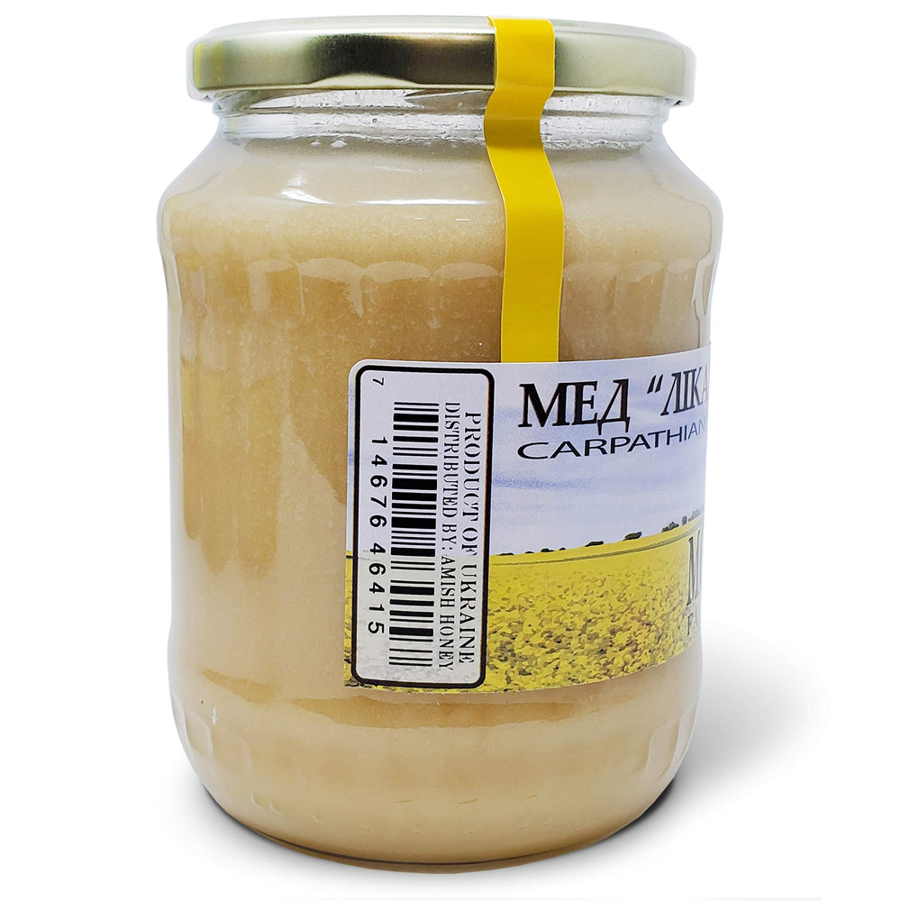 Carpathian Healer honey bottle in forest evokes sustainable harvest imagery