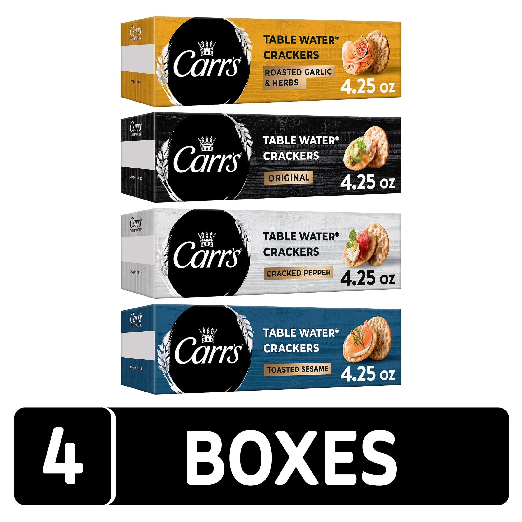Carr's Roasted Garlic and Herbs crackers box beside a charcuterie board