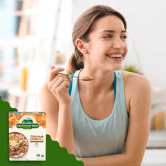 Milk being poured over Cascadian Farm Graham Crunch Cereal.