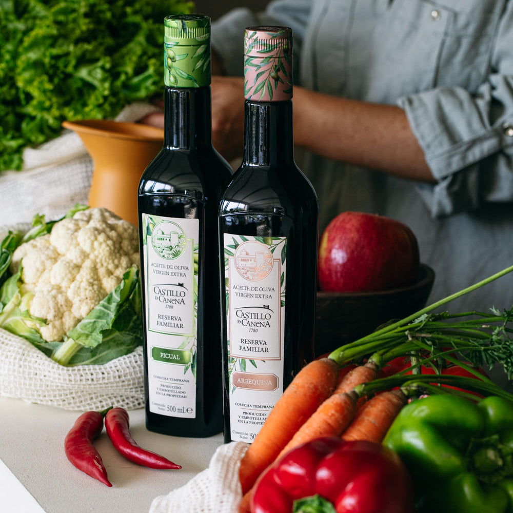 Castillo de Canena EVOO bottle with bread platter suggests dipping delight