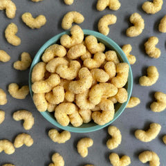 CauliPuffs cauliflower-based base emphasizes veggie-forward bite in a familiar puff snack.