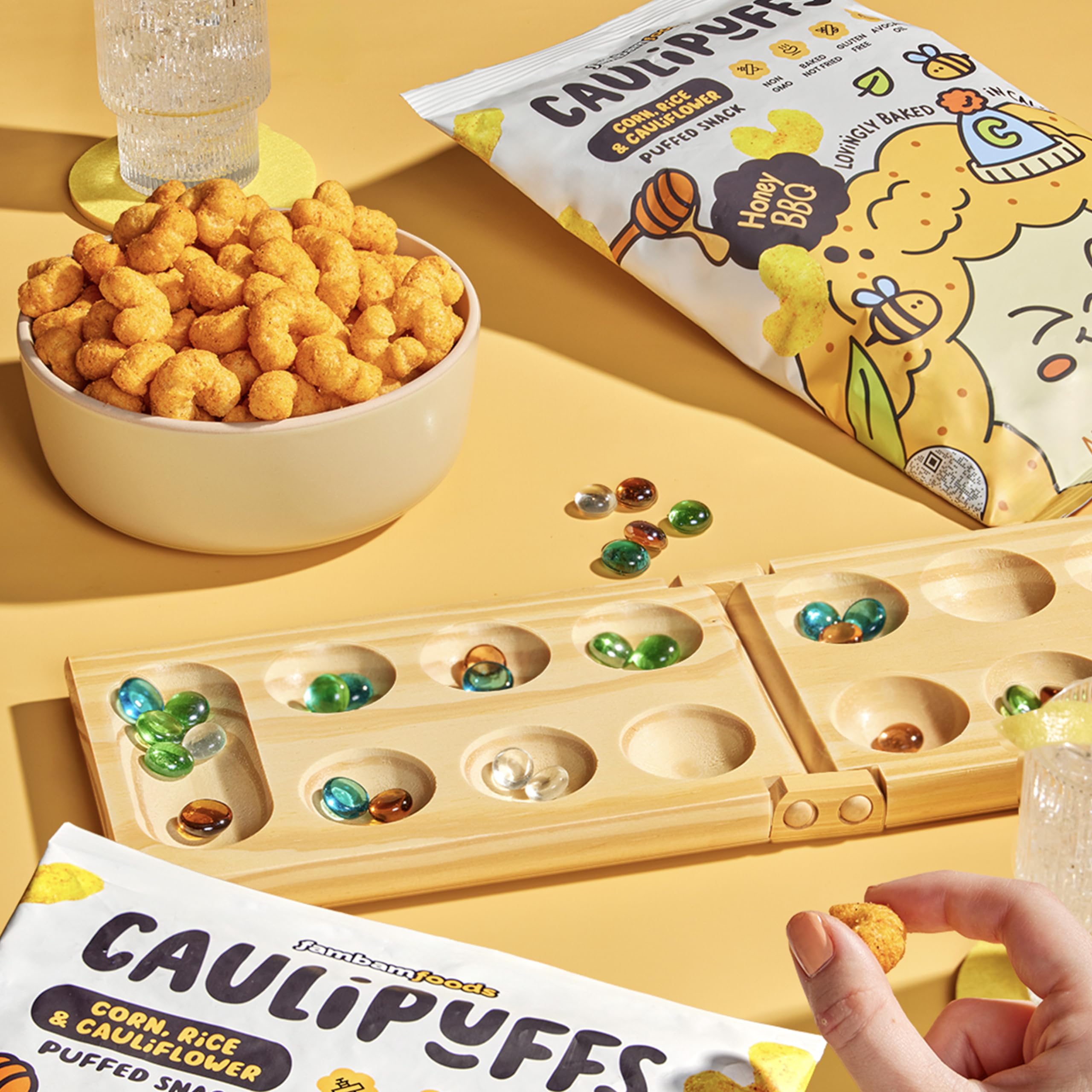 CauliPuffs Honey BBQ hero-shot — colorful bag and snacks ready for sharing.