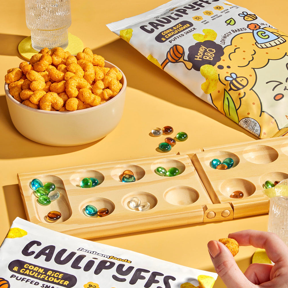 CauliPuffs Honey BBQ hero-shot — colorful bag and snacks ready for sharing.