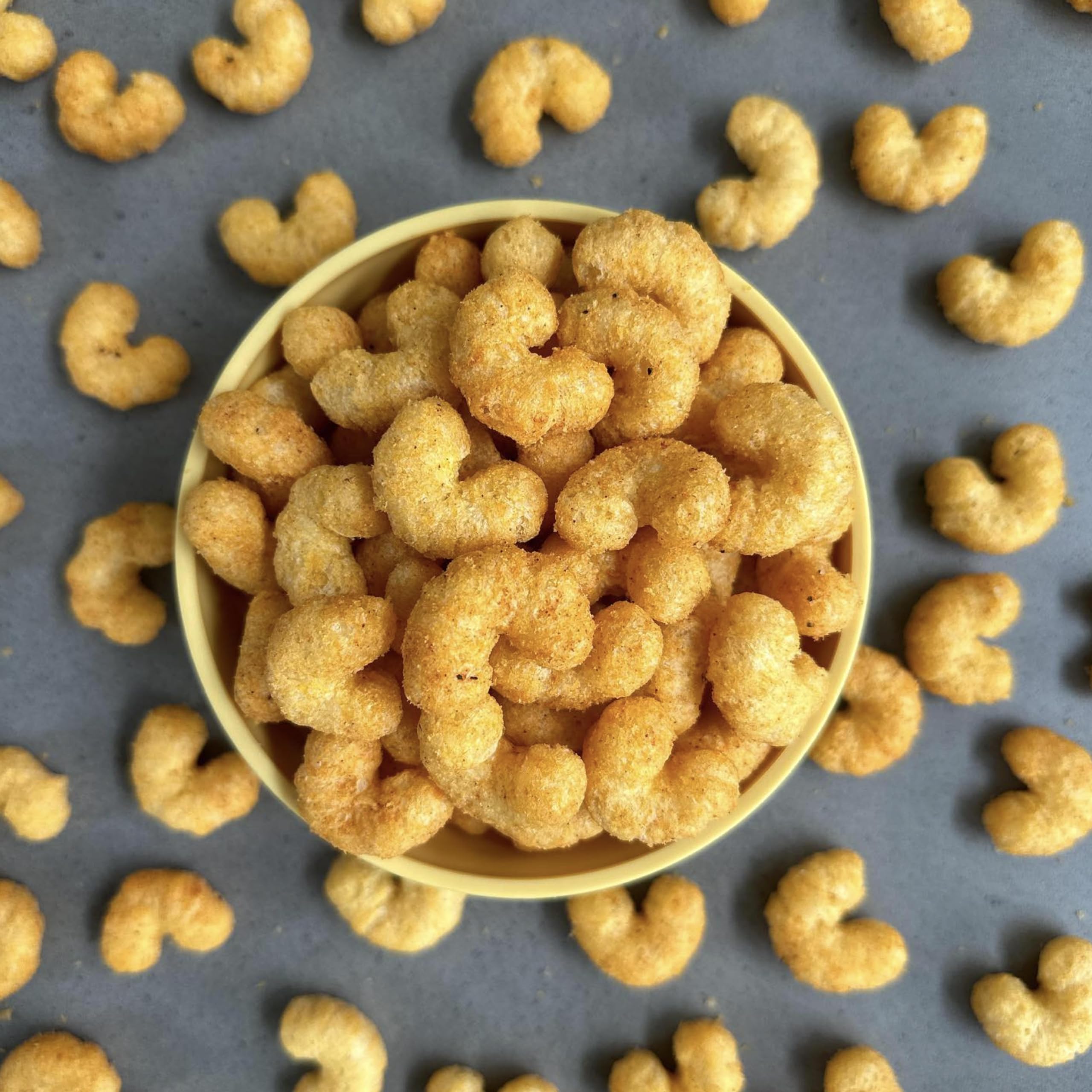 CauliPuffs Honey BBQ serving bowl — family-friendly snack for movie nights.