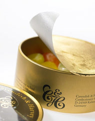 Cavendish And Harvey orange drops in gold tin, ideal travel companion and gift.
