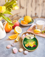 Cavendish & Harvey can beside cups, ideal for party or office snacking.