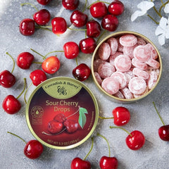 Sustainable packaging with recyclable gold tins and glass jars.