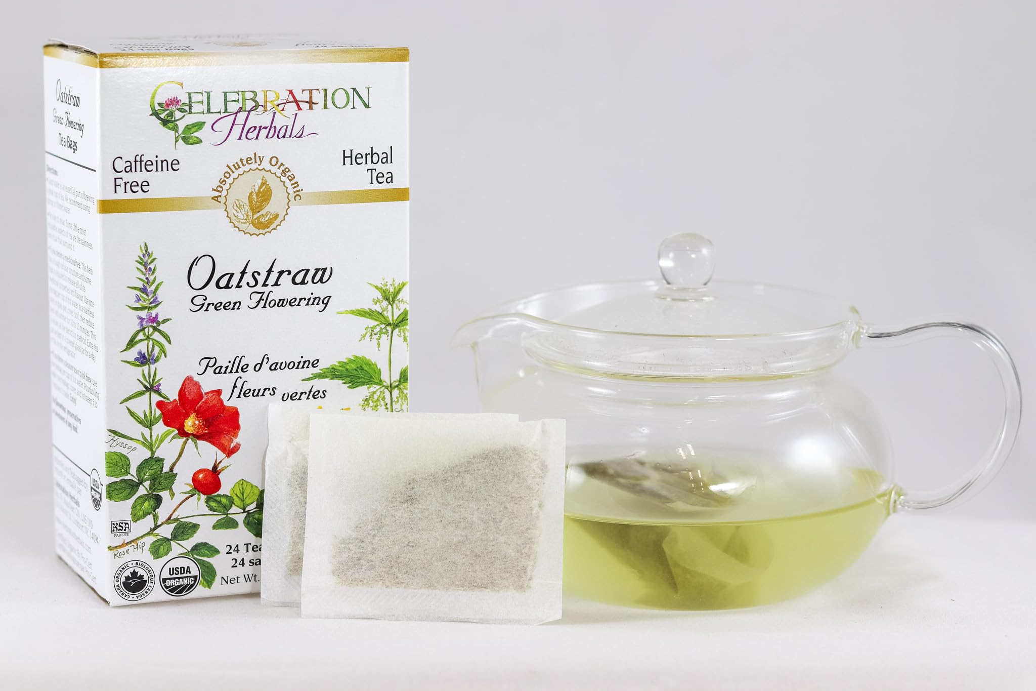 Celebration Herbals Oatstraw Green Flowering Tea bloom in a teapot, perfect for hot or iced.