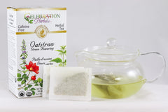 Celebration Herbals Oatstraw Green Flowering Tea bloom in a teapot, perfect for hot or iced.