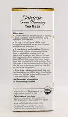 Celebration Herbals Oatstraw Green Flowering Tea loose leaves in a glass teacup.