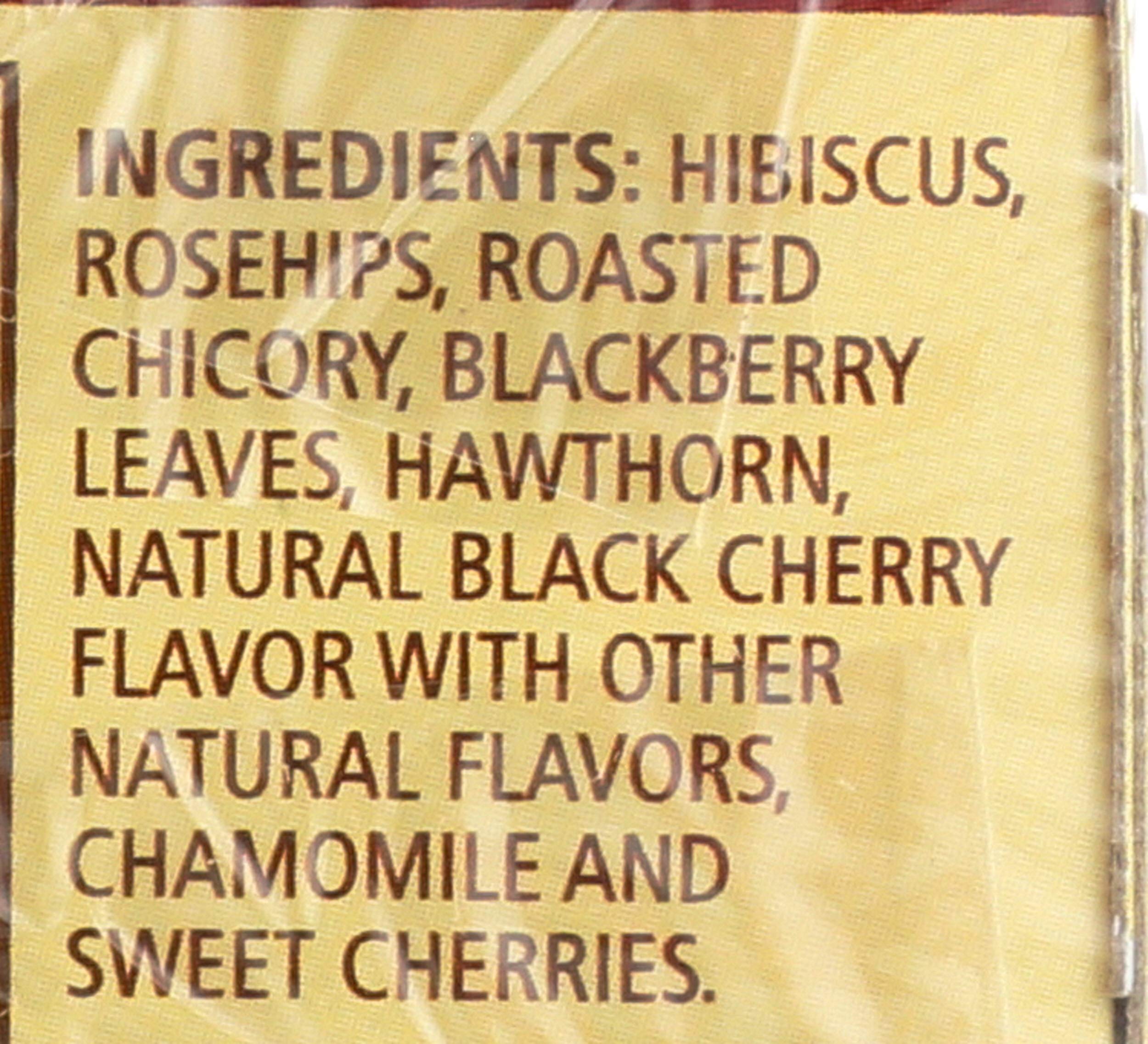 Close-up shows hibiscus and rosehips in the herbal blend.