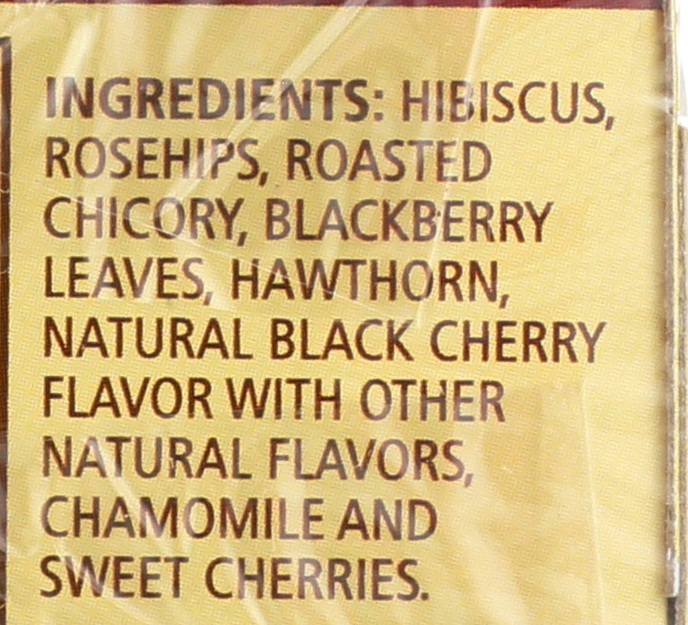 Close-up shows hibiscus and rosehips in the herbal blend.