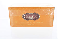 Close-up of Celestial Seasonings Honey Vanilla Chamomile Tea box highlights natural ingredients.