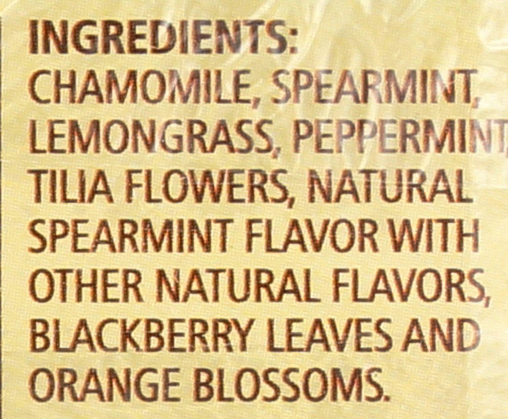 Close-up of Sleepytime Mint sachet showing peppermint leaves and chamomile.