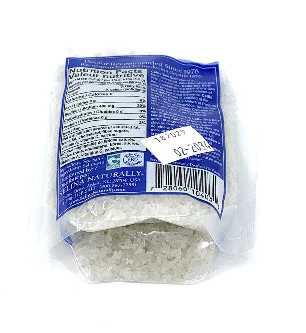 Scoop of Celtic Sea Salt light grey coarse salt enhances recipes.