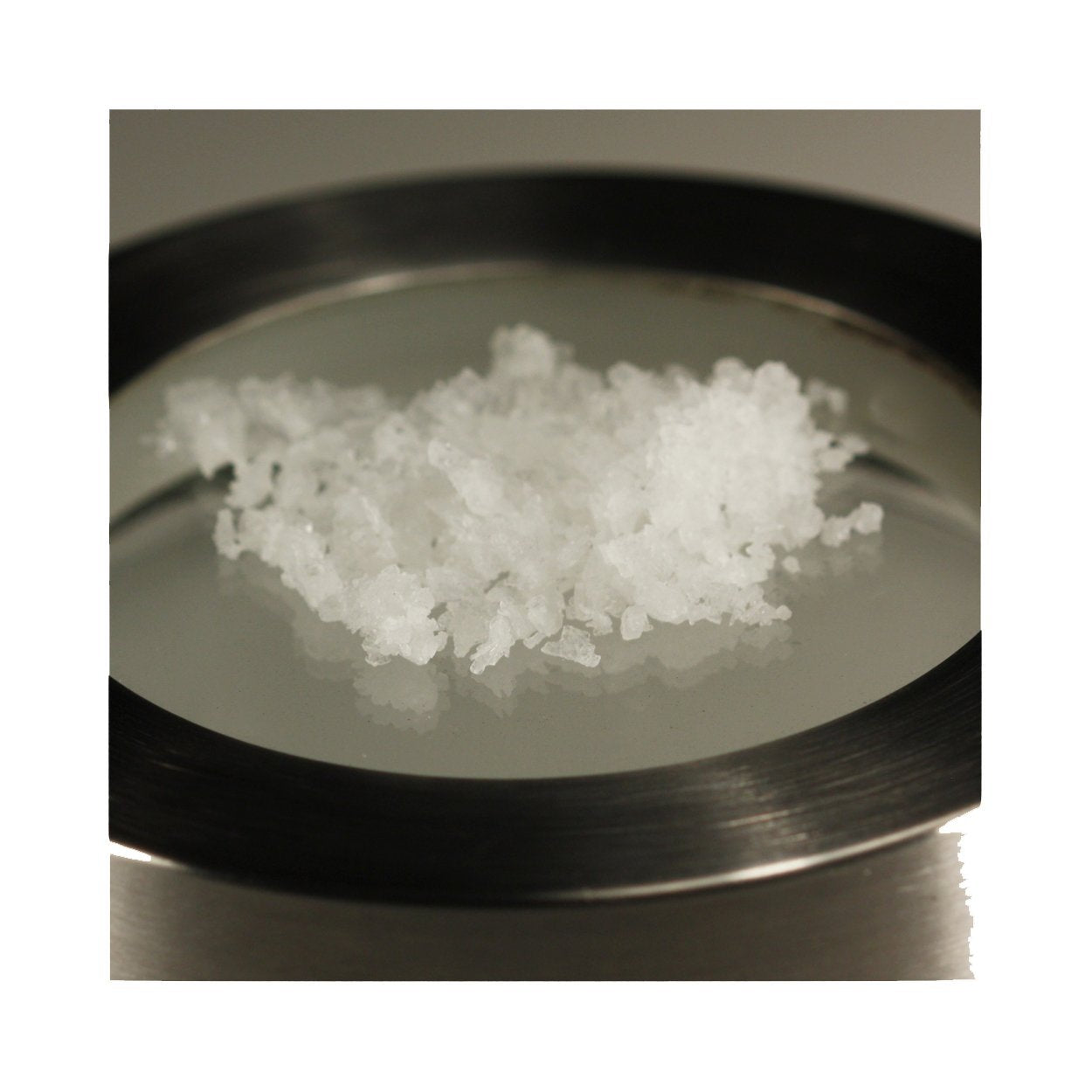 Kitchen scene showing Makai Pure as a finishing salt for vibrant flavor