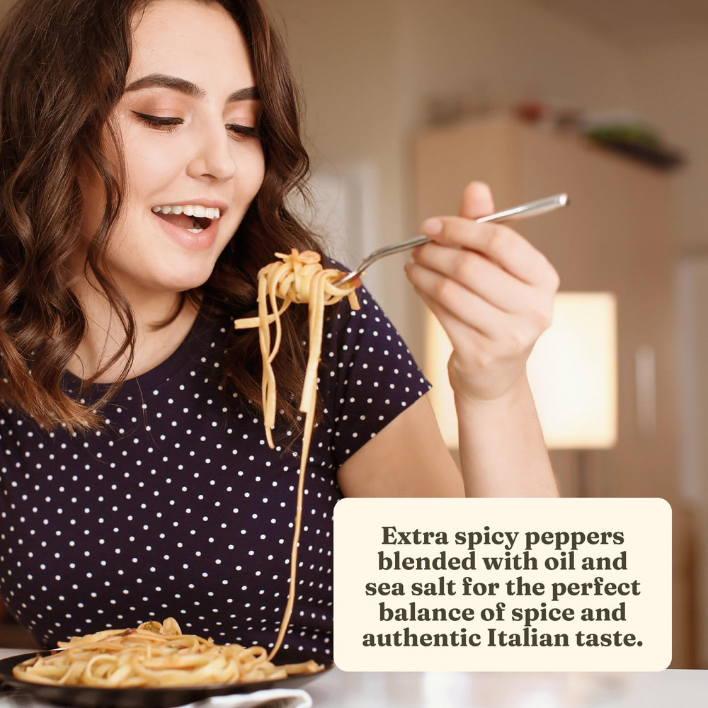 Tasting spoon with Cento pepper spread ready for dipping.
