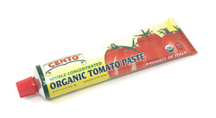Cento tomato paste being stirred into sauce for quick weeknight dinner.