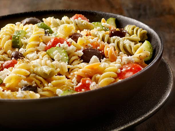 CENTRAL GROCERY Olive Salad tossed with pasta for quick, savory meals.