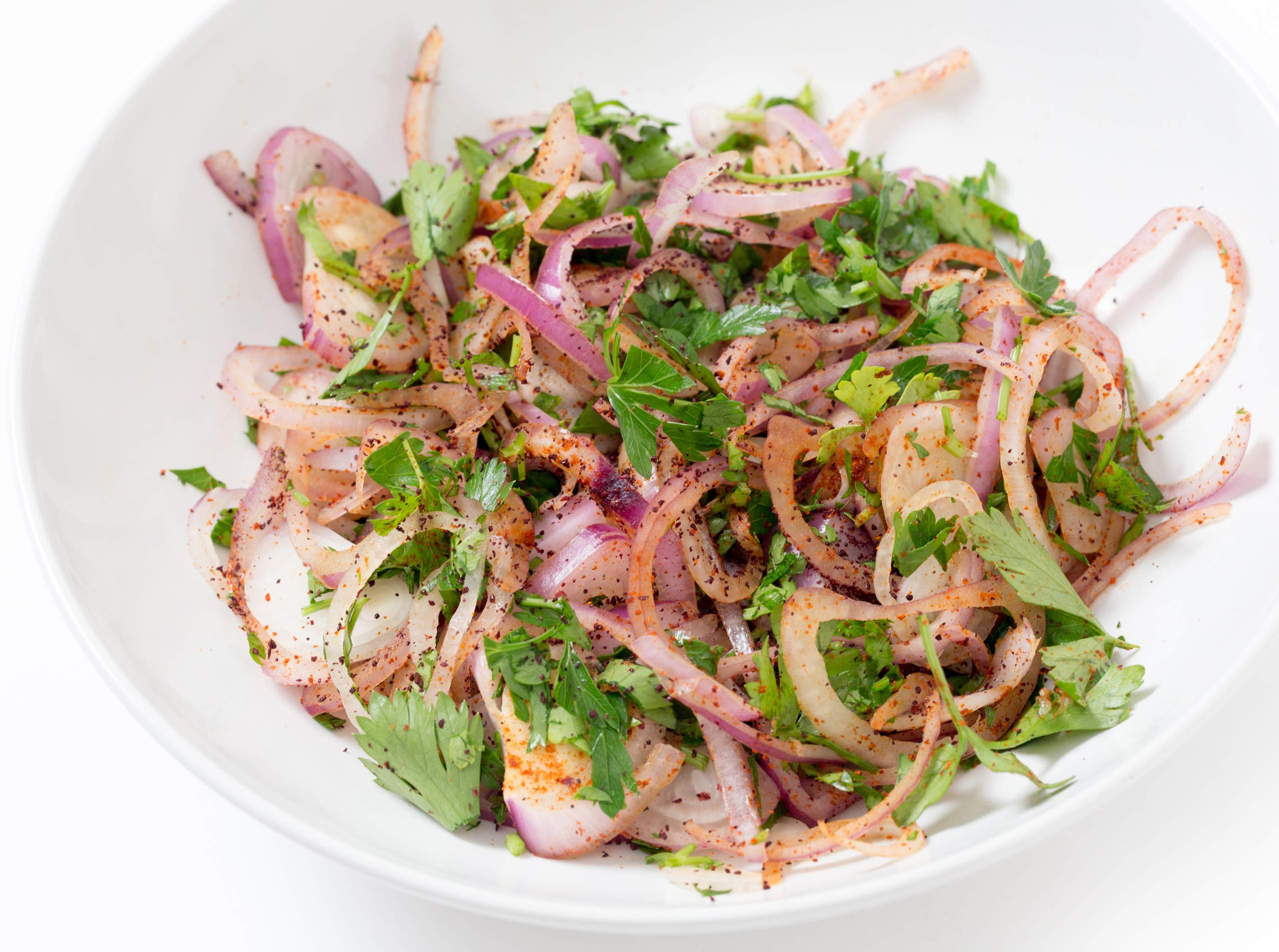 Cerez Pazari sumac powder dusted over salad adds color and brightness