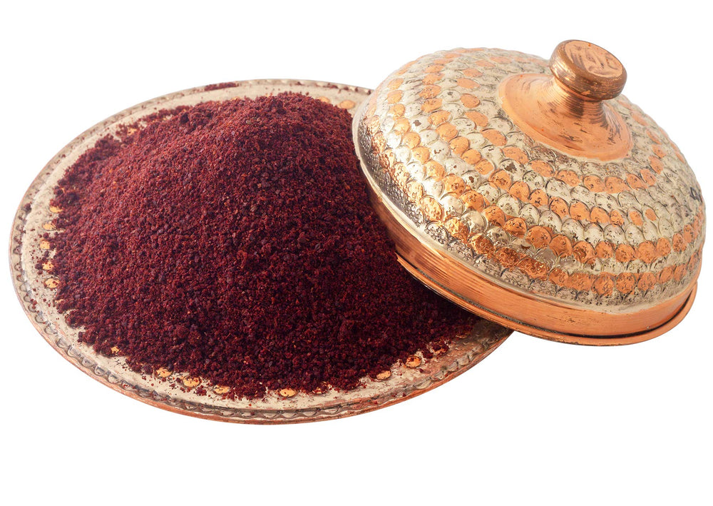 Çerez Pazarı sumac spice on salad dressing, adds color and tang.