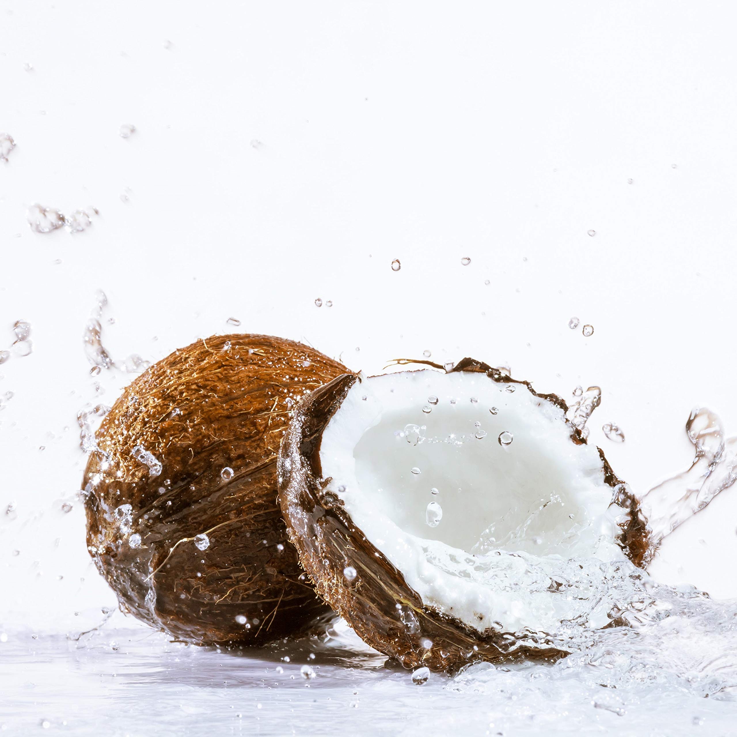 Close-up of Chaokoh coconut gel in syrup showing glossy texture and coconut bits for dessert topping.