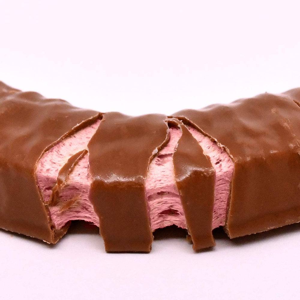 Charleston Chew Strawberry retro packaging displayed, evokes nostalgia and shareable moments.
