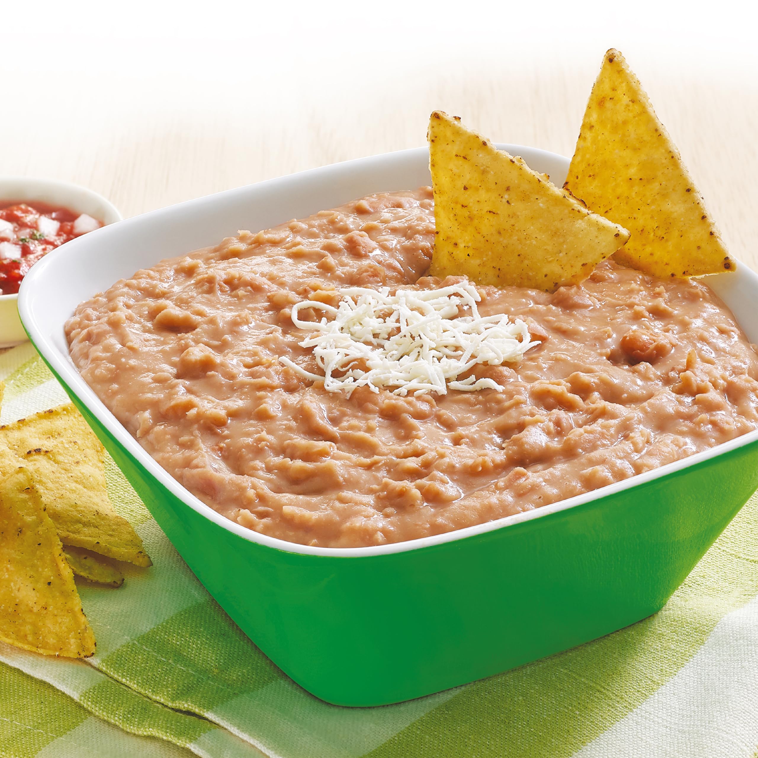 Chata refried pinto beans ready-to-heat serving dish, smooth texture for comforting meals.