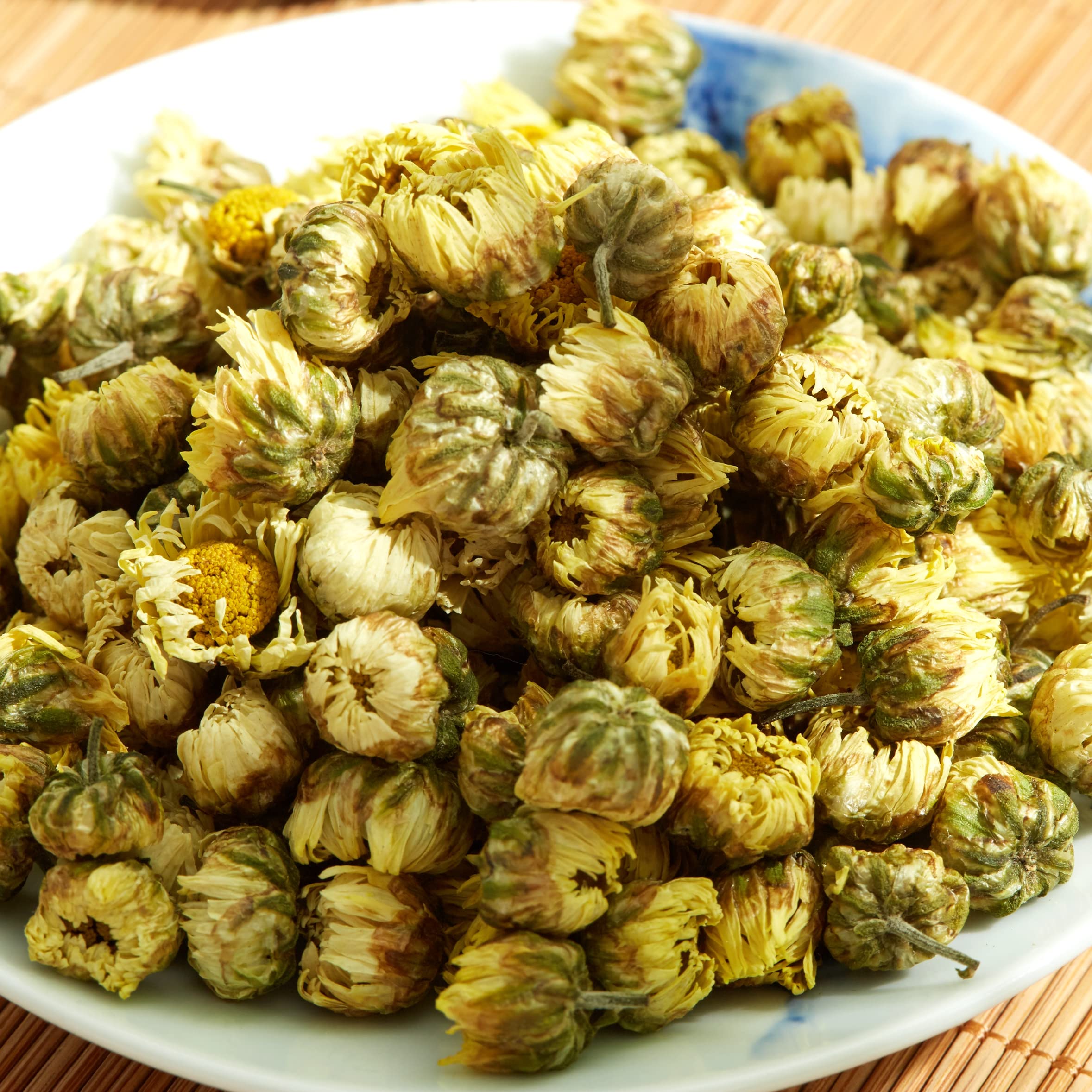 ChaWuWarmSun TongXiang origin field, highlighting premium chrysanthemum harvest for discerning tea lovers.