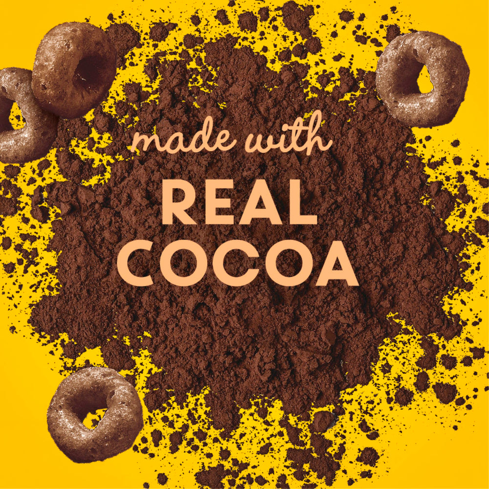 Spoon dipping into Cheerios Chocolate bowl highlighting crunchy texture