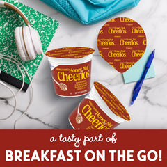 Cheerios Honey Nut cereal cup with lid on for quick, mess-free serving.