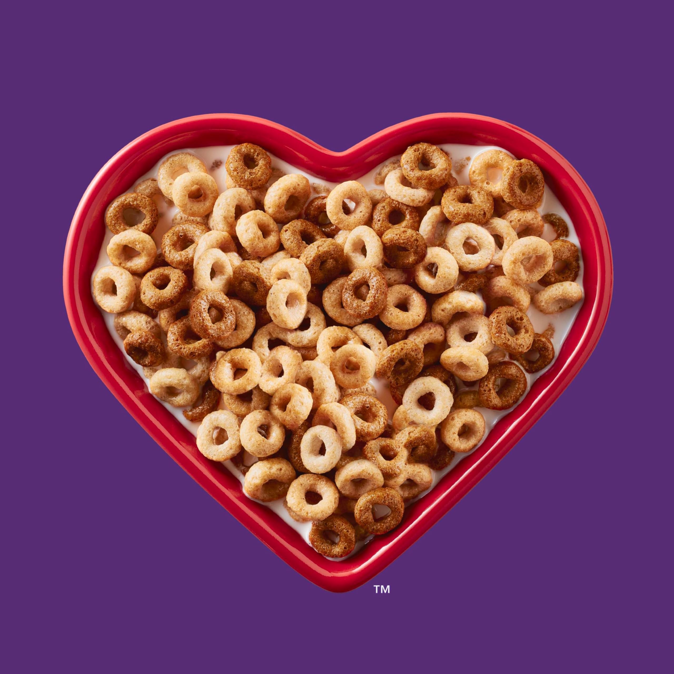 Pour Cheerios Multi Grain into a bowl, showcasing the crunchy texture.