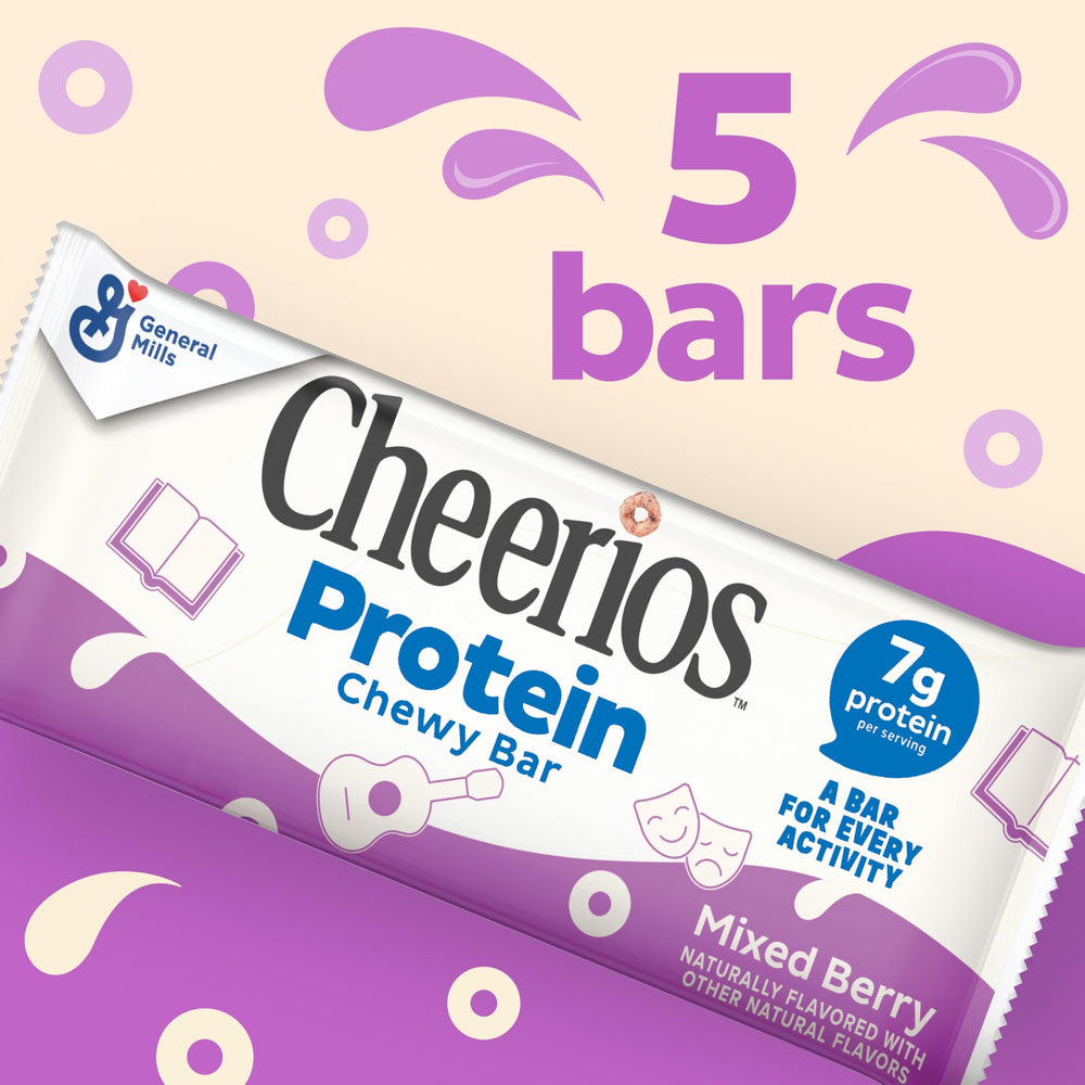 Hand holding Cheerios Protein Chewy Bars Mixed Berry for on-the-go energy.