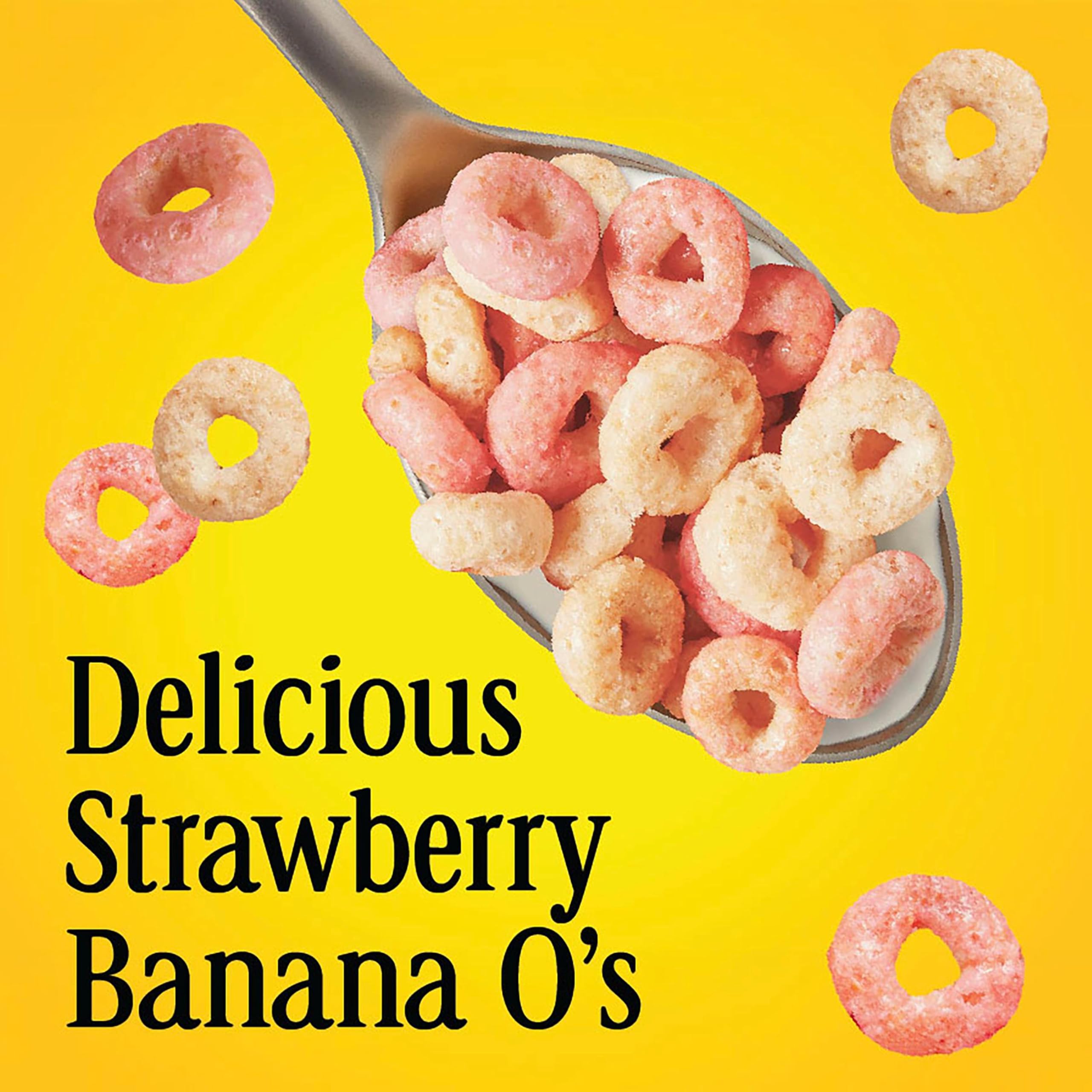 Pouring Cheerios Strawberry Banana into a bowl for breakfast