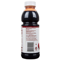 Pouring Cherry Bay Orchards concentrate into a glass for a refreshing beverage