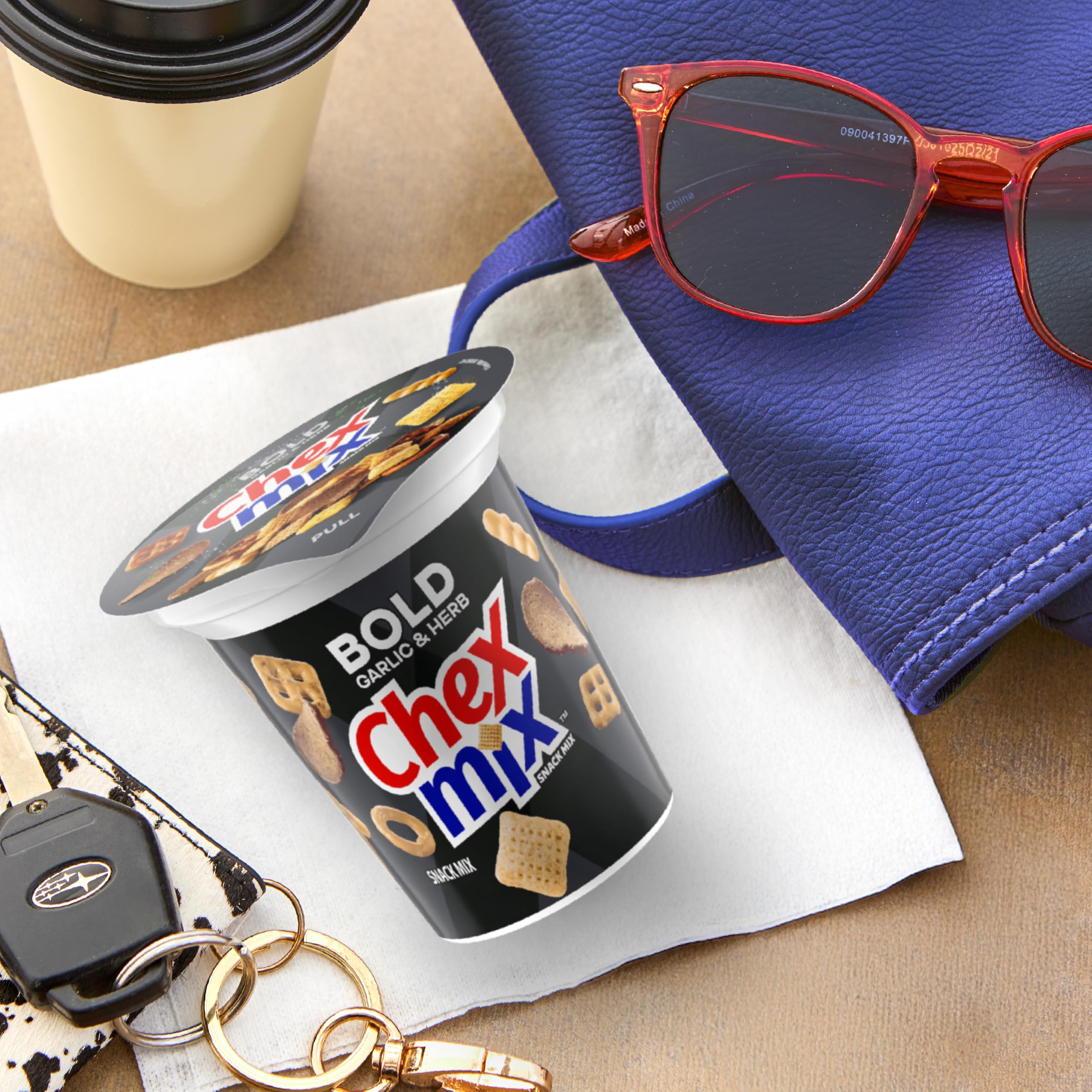 Chex Mix Bold Garlic and Herb snack cup in backpack for quick bites
