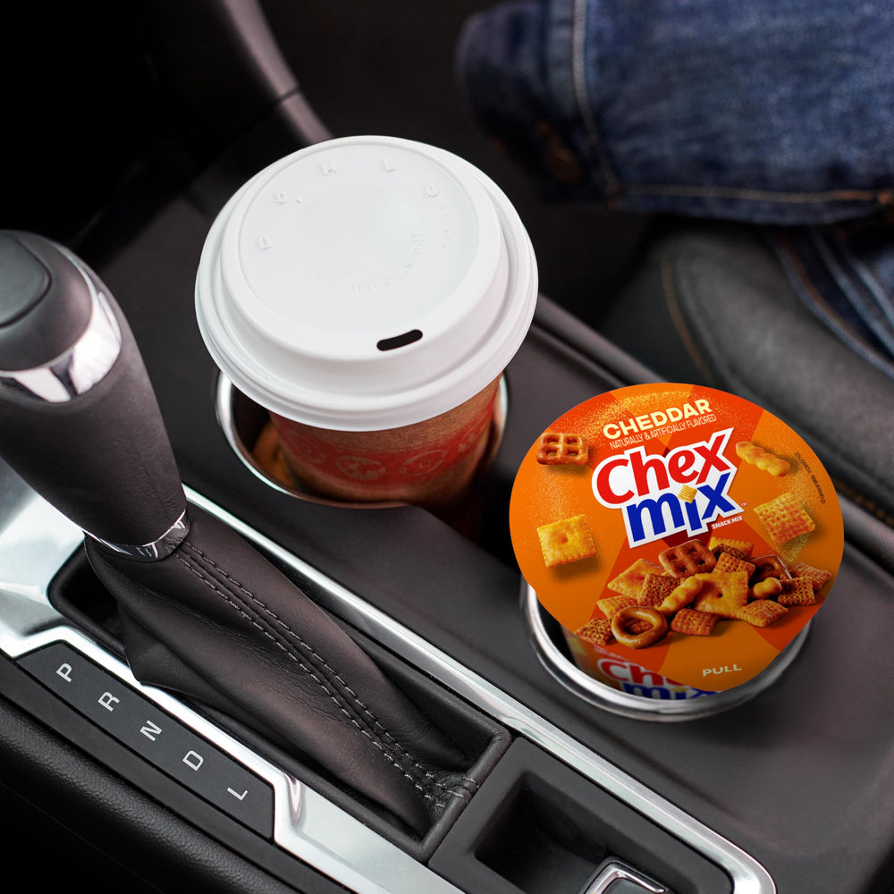 Chex Mix Cheddar Snack Cup in car cupholder for on-the-go snacking.