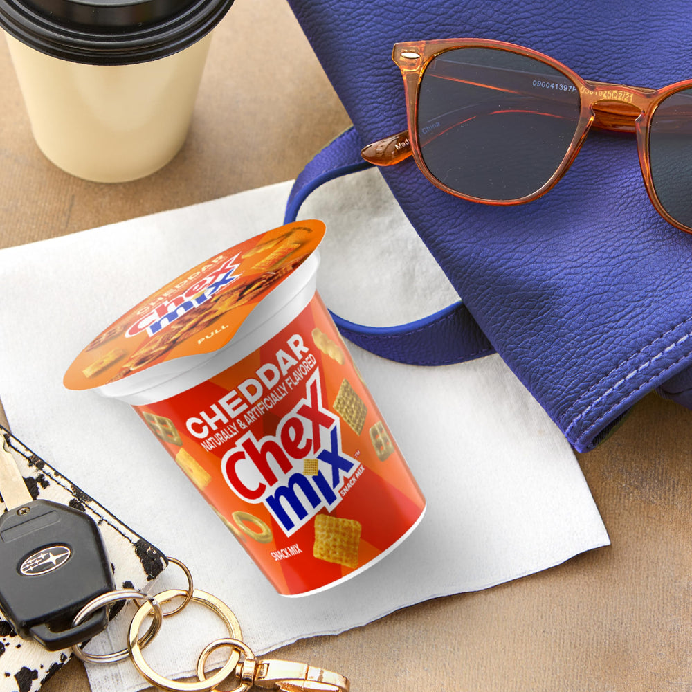 Chex Mix Cheddar Snack Cup in lunchbox for quick bites.