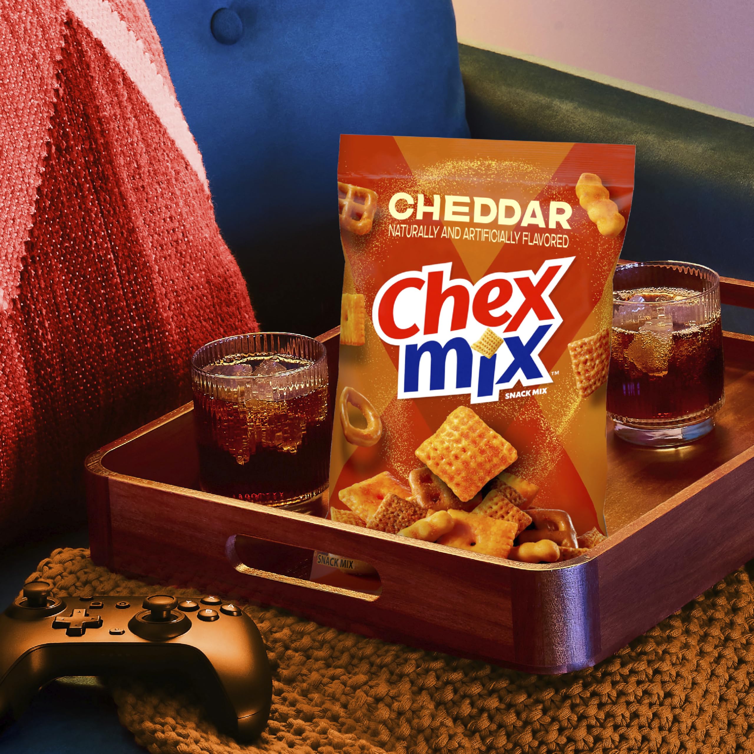 Chex Mix Cheddar tub variety of shapes and colors in mix.