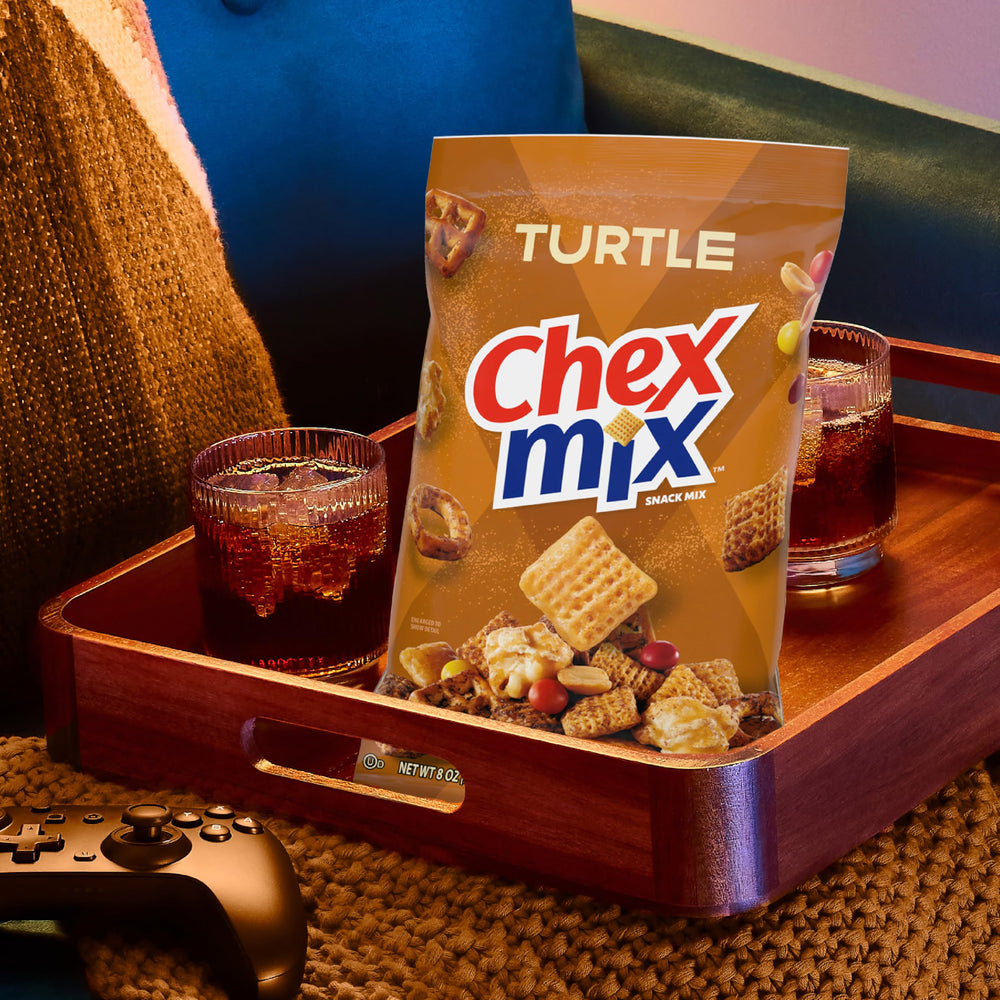 Chex Mix Turtle Snack Mix on kitchen counter for game night.