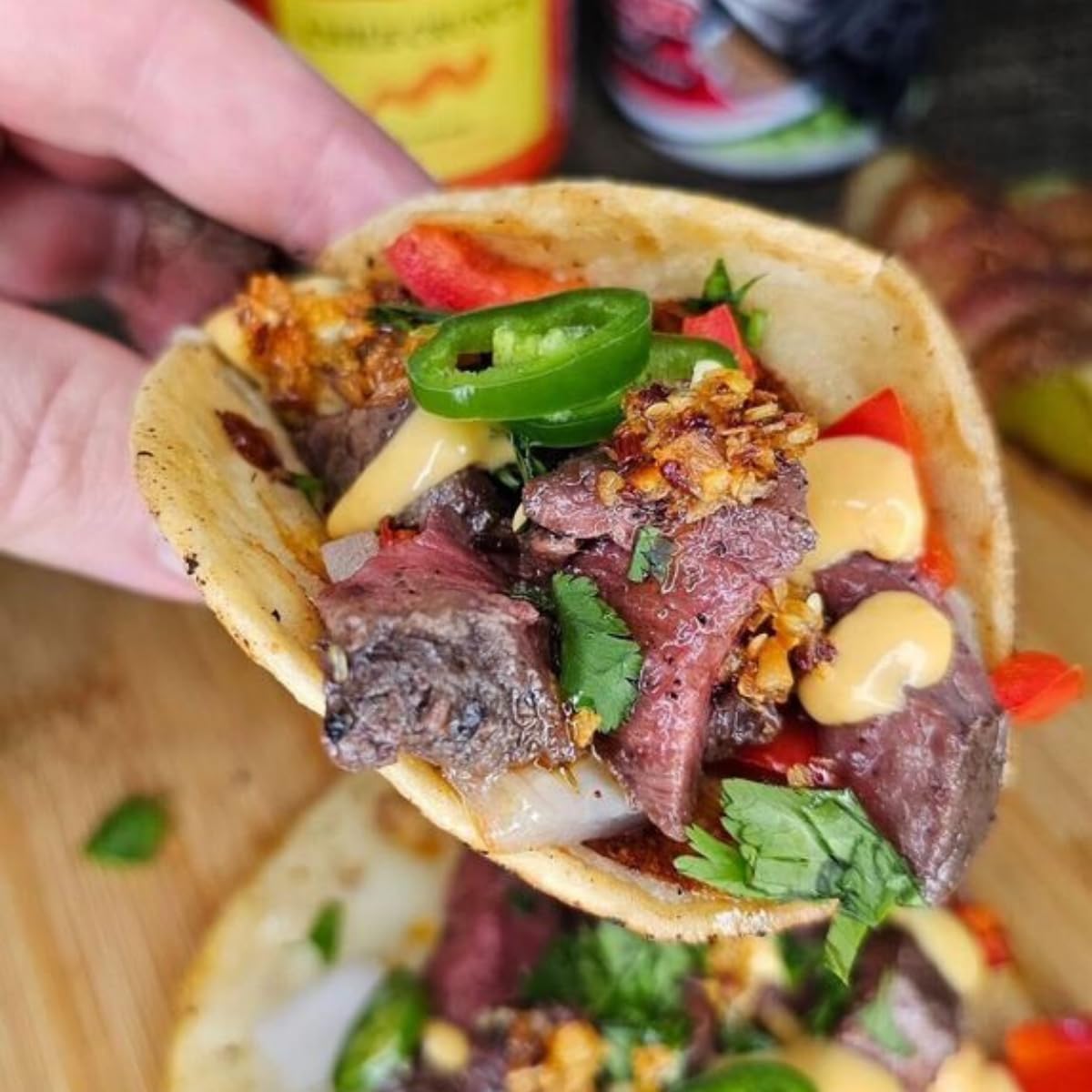 Chile Crunch uses salsa topping concept with spoonful on vegetables.